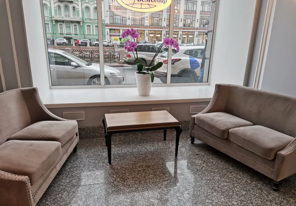 Wide white solid surface window sill in a lobby seating area