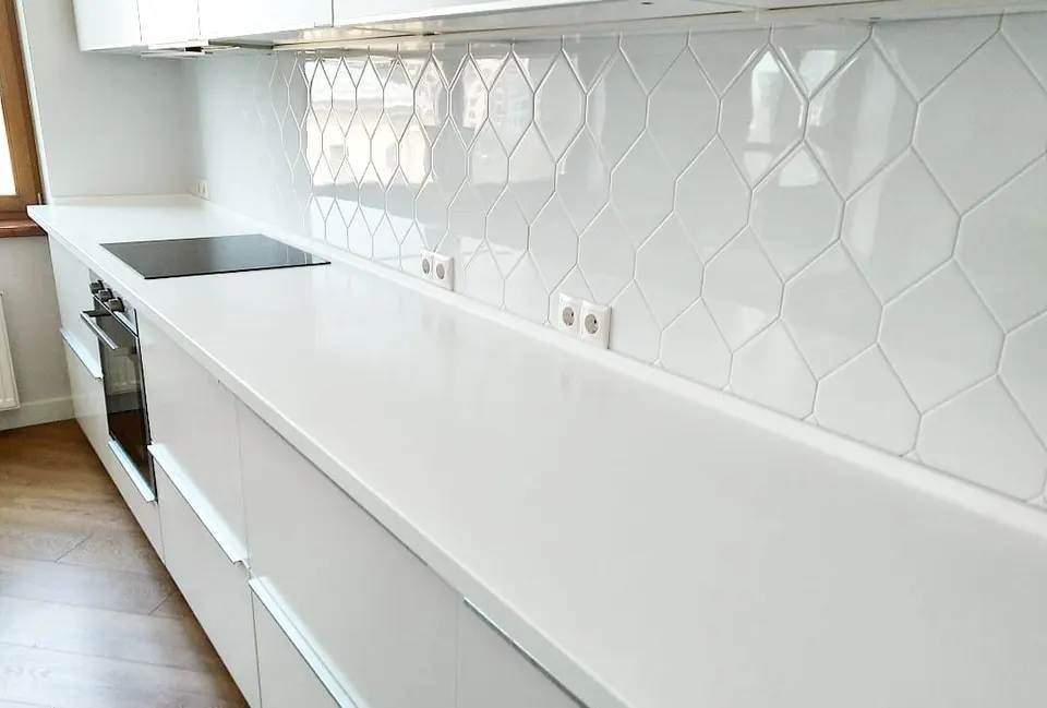 White solid surface kitchen worktop with upstand