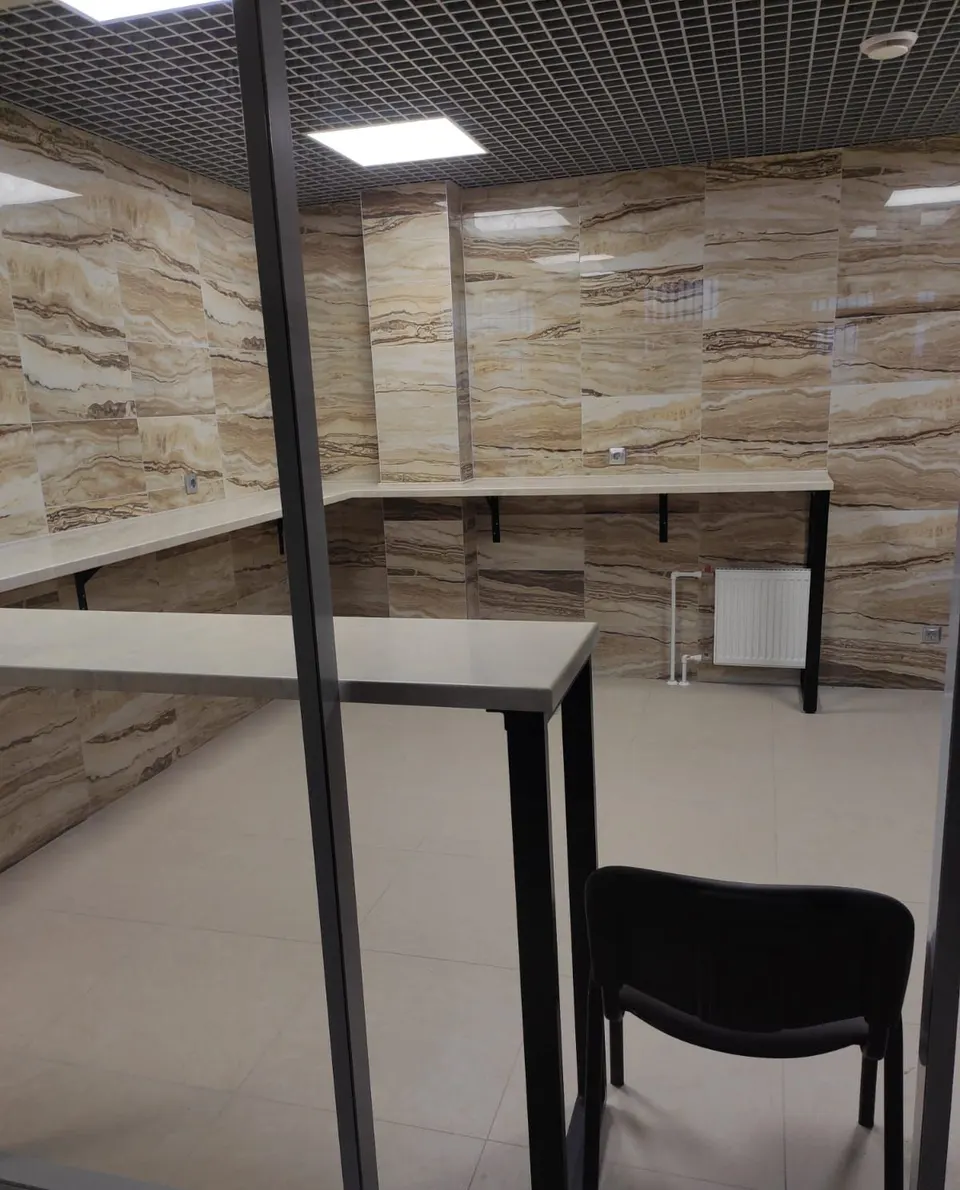 Solid surface work counter in a glazed office room