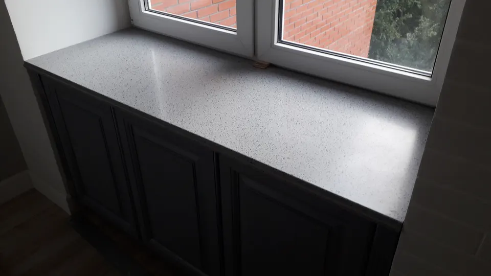 Grey speckled solid surface window seat top